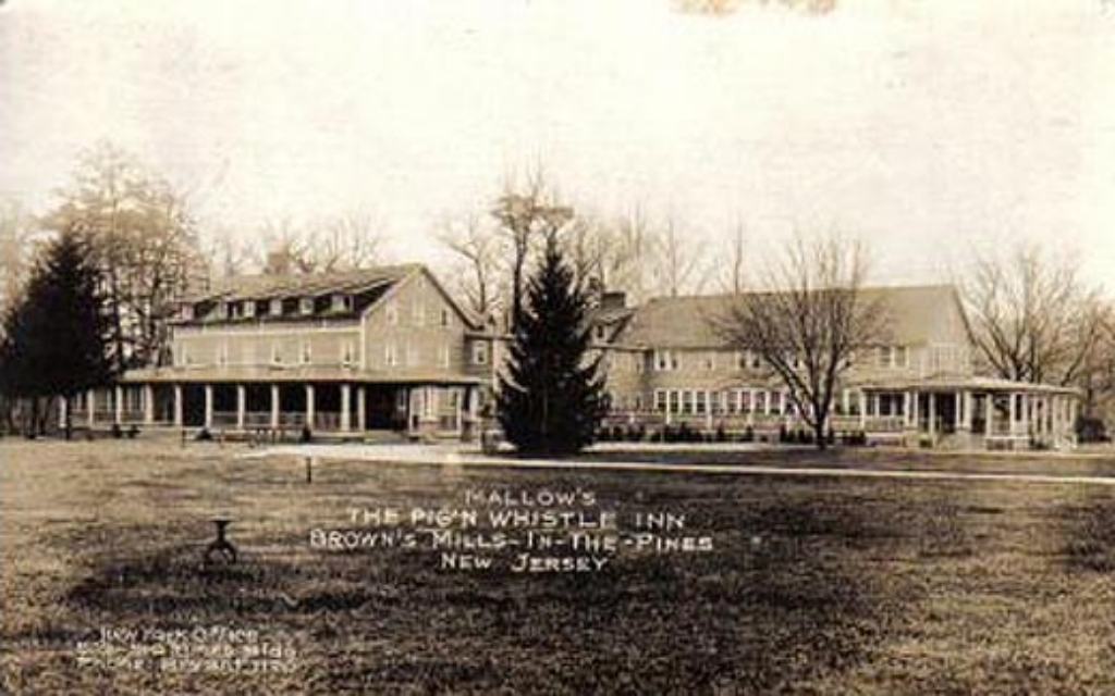 Historic postcard of Mallow's Whispering Pines Inn among the pines