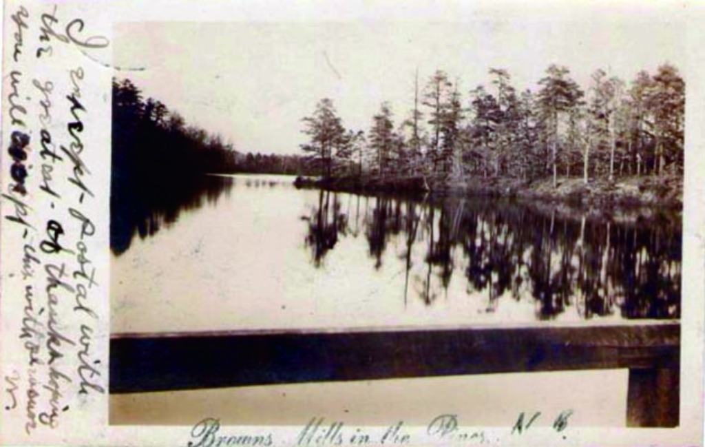Historic postcard view of Mirror Lake at Browns Mills, calm water with trees along the shore